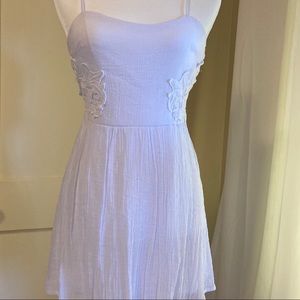 White gauzy dress with floral embroidery on sides